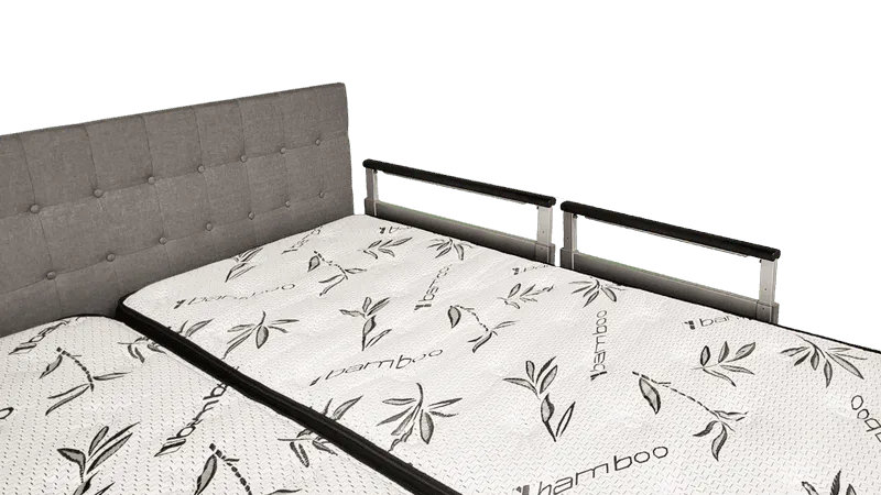 Image of a companion bed from a corner to showcase the assist rails.