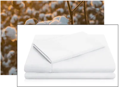 Folded white bed sheets with a cotton field in the background. #Elementor