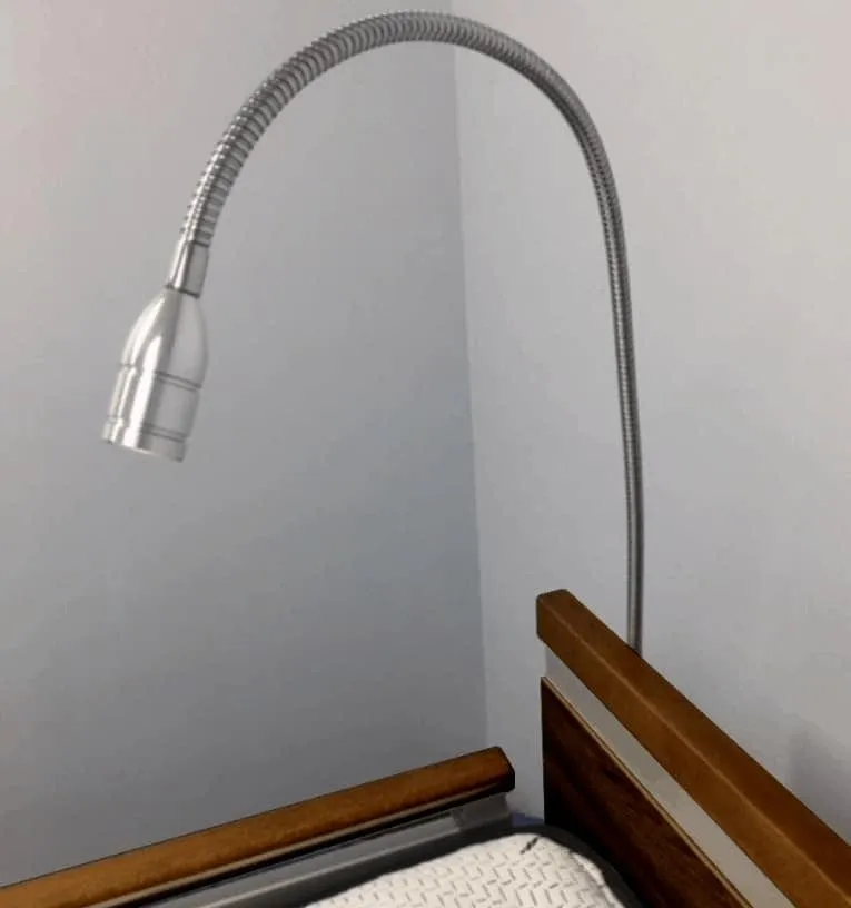SonderCare LED gooseneck overhead reading light mounted above a bed