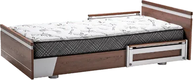 A hospital bed with a Aura Platinum 39 Upwork mattress and drawers.