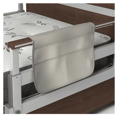 A bed caddy hanging off the side of a single product wooden bed rail.