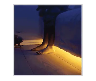 a person standing on a bed with their feet up.