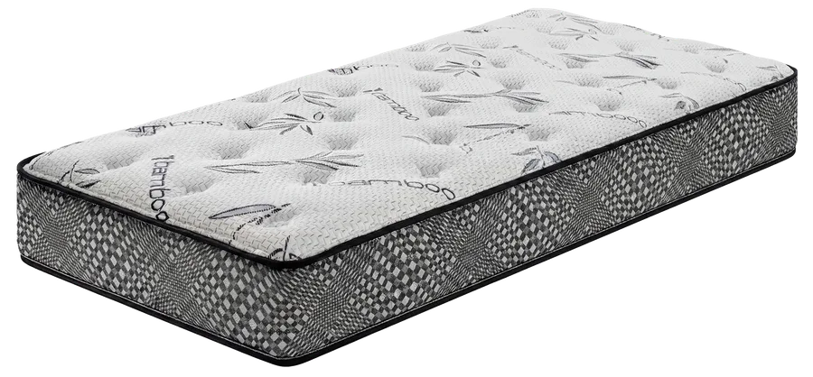A black and white patterned queen-sized dream mattress with a quilted top and geometric trim on the sides, photographed against a plain black background.
