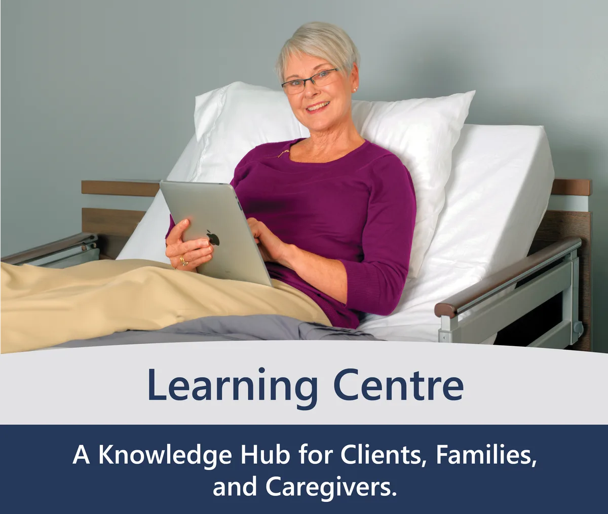 Older woman with short gray hair and glasses sits up in a hospital bed, smiling as she reads a newspaper. A white circle to the left highlights "Resources," offering helpful support during her stay.