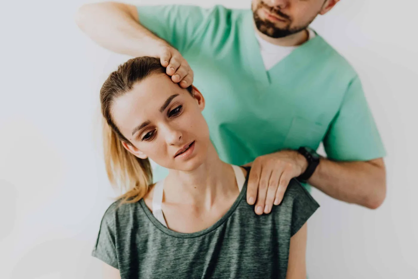 a man helping a woman with her hair.